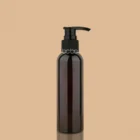 Black lotion pump bottle mockup on beige background
